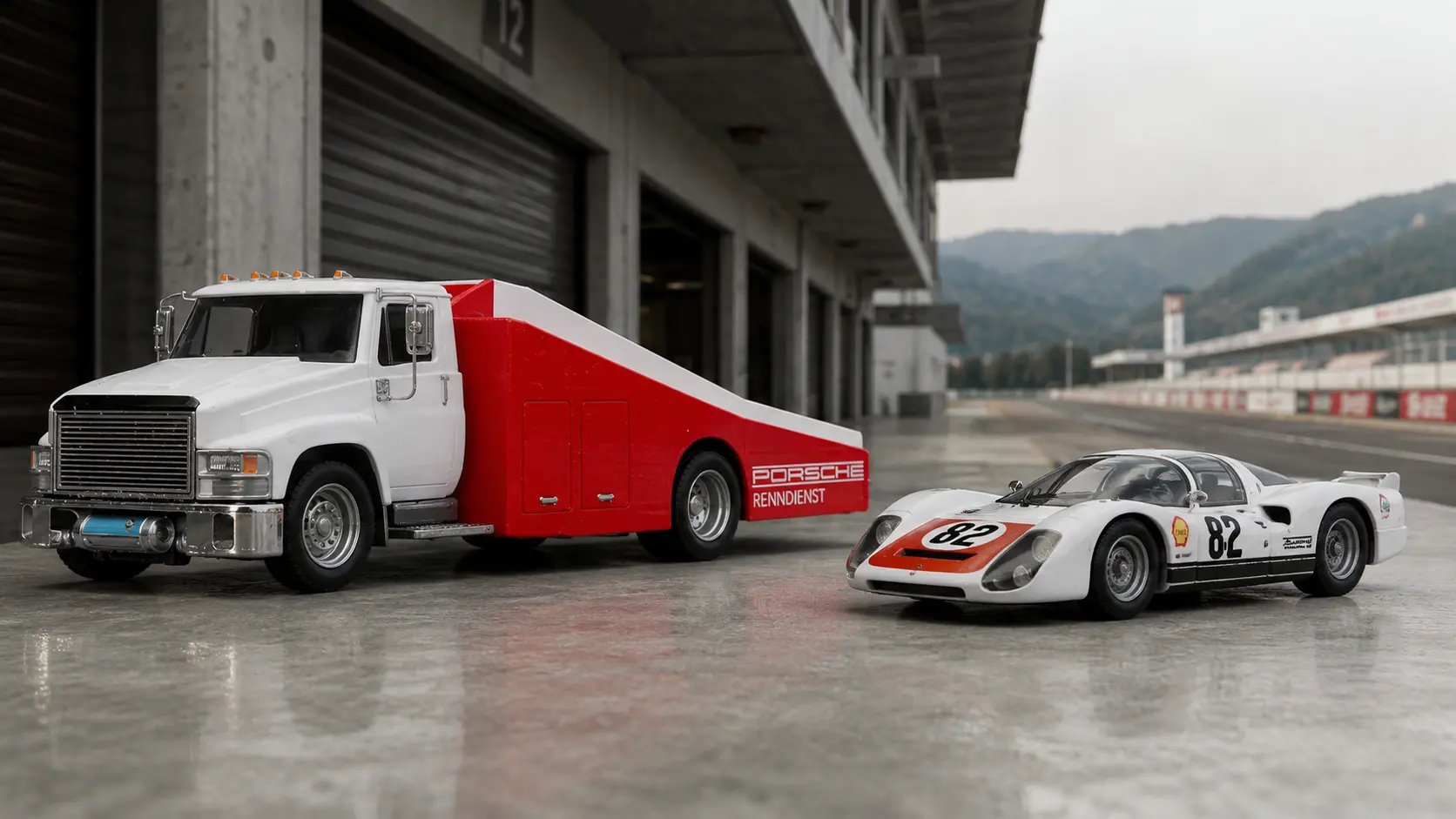 1966 Porsche 906 Carrera 6 beside Carry On Team Transport in a historic European miniature paddock
