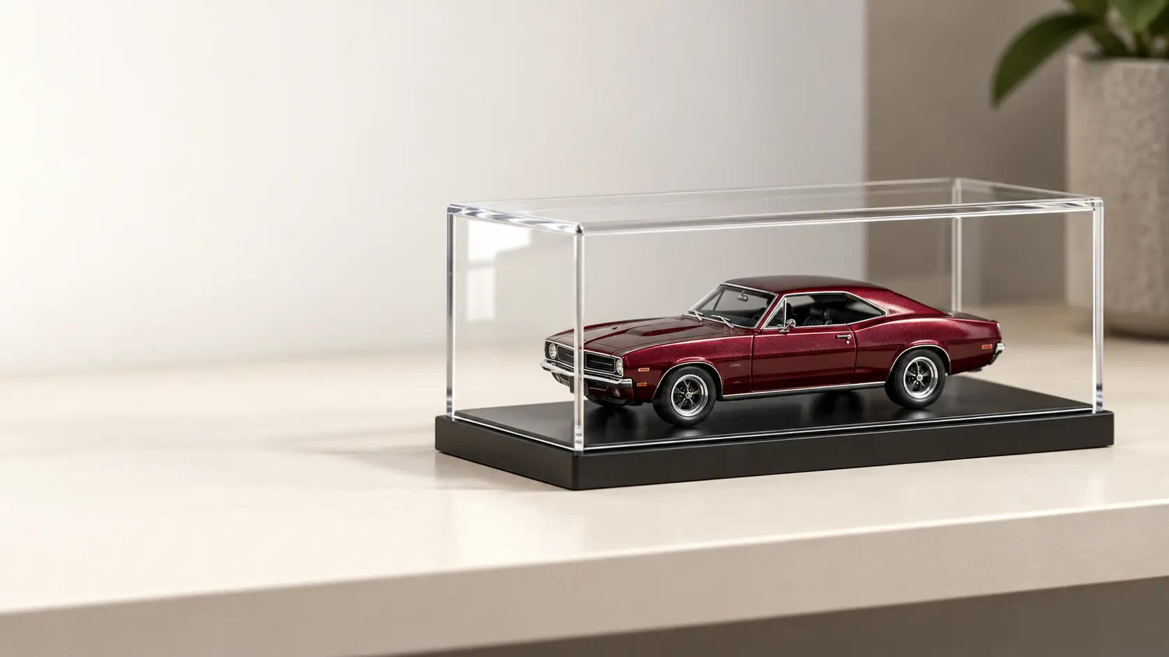 Illustrative clear single-car acrylic display case holding a loose miniature diecast car