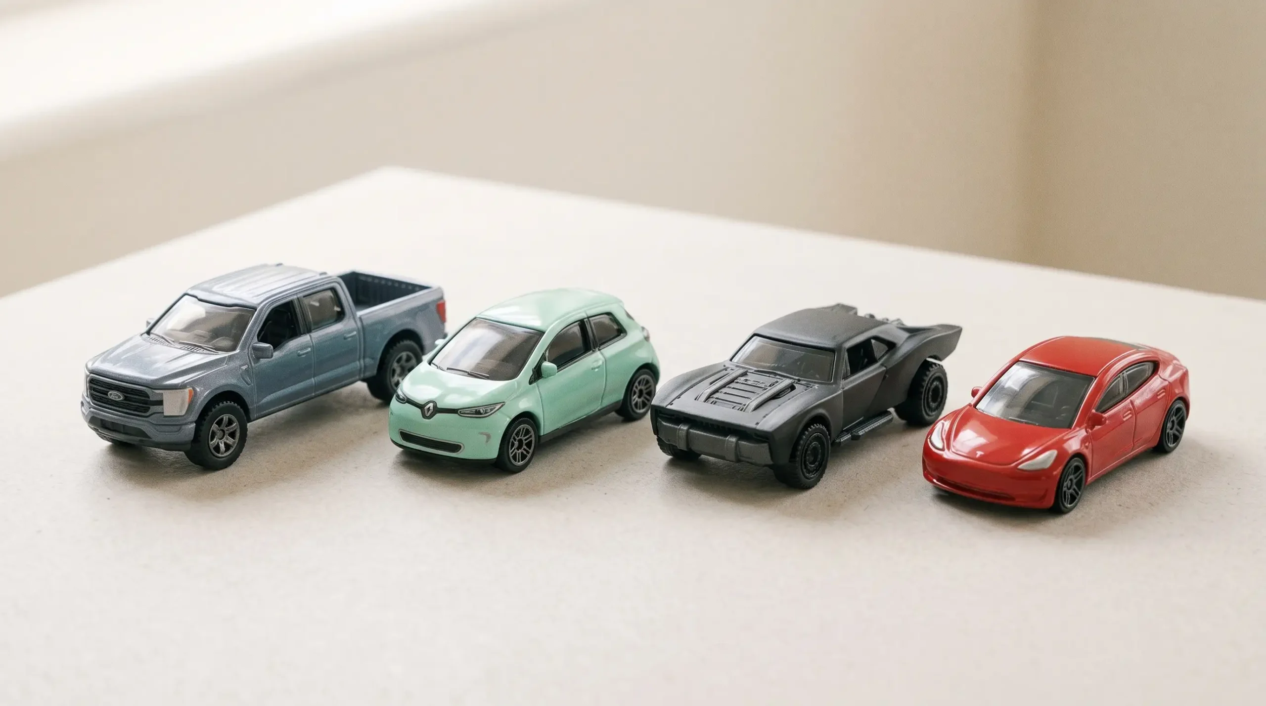 Four illustrative miniature vehicles representing pickup trucks, compact electric cars and fantasy-car collecting themes